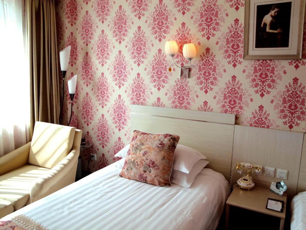 Overseas Chinese International Hotel Qingdao Chambre photo